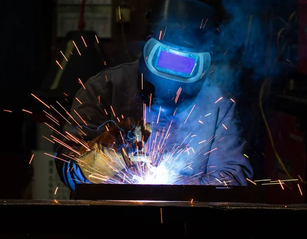 worker with a metal grinder