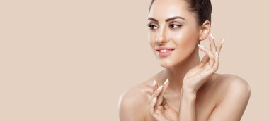Beautiful woman portrait, skin care concept, beautiful skin. Portrait of female hands with manicure nails touching her face. Spa. Girls cosmetics. Facial treatment. Panorama With Copy Space