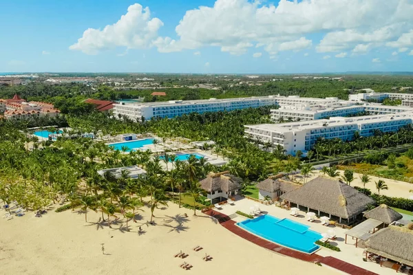 Pool area and bars in a tropical tourist resort, lux hotel in Caribbean, aerial view of luxury hotel with exotic poolside. Aerial view of luxury tropical resort.Drone view of resort with swimming pool