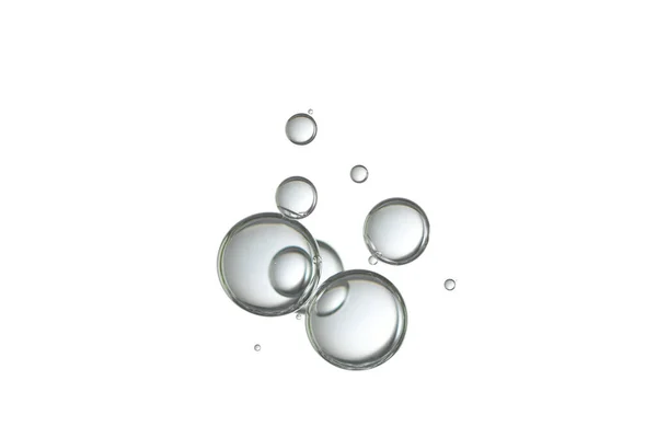 玻璃清澈的气泡 流过白色的背景 — 图库照片
