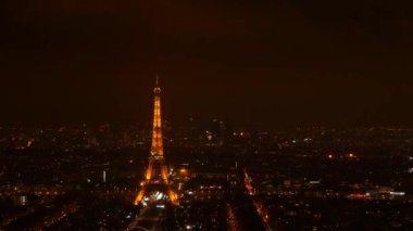 January 22, 2023 - Paris, France. View of the night city from above, the eiffel tower at night, against the background of the night sky.