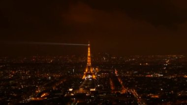 January 22, 2023 - Paris, France. View of the night city from above, the eiffel tower at night, against the background of the night sky.
