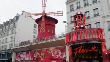 January 22, 2023 - Paris, France. The red building of the Moulin Rouge during the day. Historic world-famous cabaret theater during the day