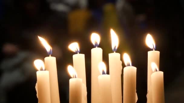 Long White Religious Candles Flames Burning Night Church Close View — Stock Video