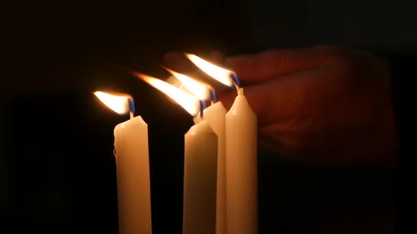 Long White Religious Candles Flames Burning Night Church Womans Hand — 图库视频影像