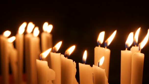 Long White Religious Candles Flames Burning Night Church Close View — Video