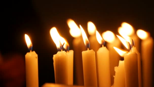 Long White Religious Candles Flames Burning Night Church Womans Hand — Vídeos de Stock