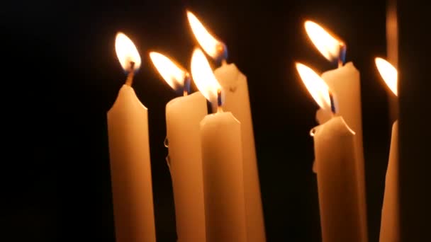 Long White Religious Candles Flames Burning Night Church Womans Hand — Vídeo de stock