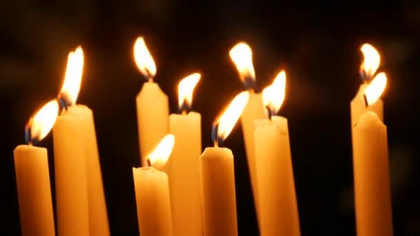 Long White Religious Candles Flames Burning Night Church Close View — Vídeos de Stock
