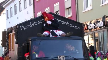 February 12, 2023 - Kehl, Germany: Festive Rosenmontag carnival procession on the occasion of spring in Baden Wurttemberg. People in scary and funny costumes entertain the audience, laugh, play, sing.