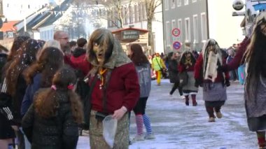 February 12, 2023 - Kehl, Germany: Festive Rosenmontag carnival procession on the occasion of spring in Baden Wurttemberg. People in scary and funny costumes entertain the audience, laugh, play, sing.