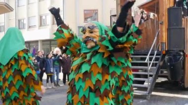 February 12, 2023 - Kehl, Germany: Festive Rosenmontag carnival procession on the occasion of spring in Baden Wurttemberg. People in scary and funny costumes entertain the audience, laugh, play, sing.