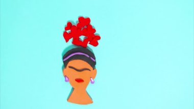 February 15, 2023 - Kehl, Germany: Stop motion animation of plasticine for Valentines Day, the main character in hearts moving on a blue background. Claymotion famous character in art