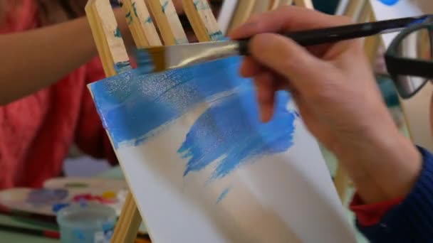 Drawing Lessons Artists Hand Paints Picture Canvas Brush Studio — Stock Video
