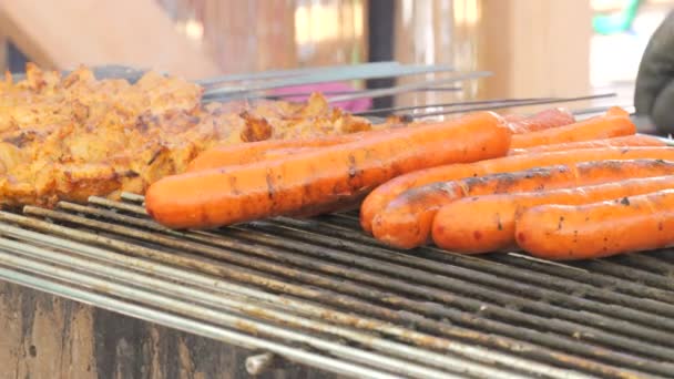 Street Food Cook Flips Big Fat Sausages Grilled — Stock Video