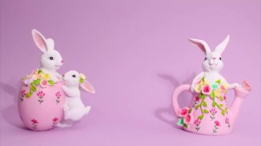 Paskalya Hareketi animasyonu. Güzel Paskalya tavşanları çerçevede hareket ediyor. Plastik bir yazı var. Arka planda Mutlu Paskalyalar var..