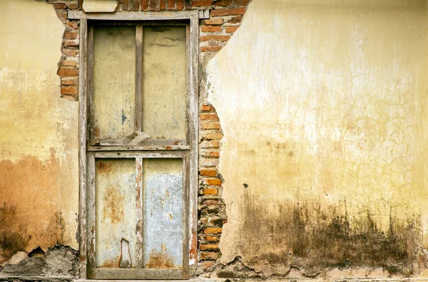 Old broken wooden door in Yogyakarta, Indonesia, for wallpaper