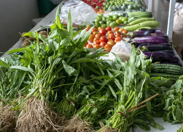 A pile of water spinach (Ipomoea aquatica), and othes vegetables in traditional market in Yogyakarta, Indonesia