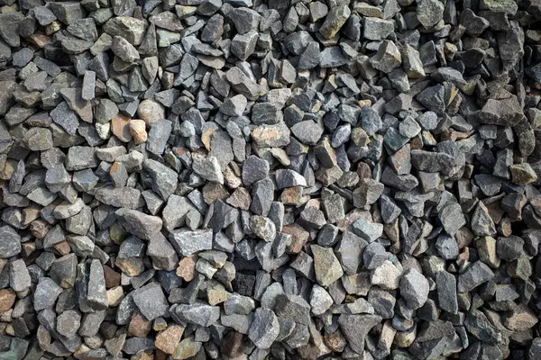 Natural colors of stone fragments from volcanic rocks for background.