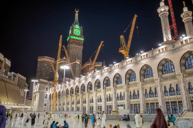 Mecca, Saudi Arabia - May 27, 2024: View of the Mecca Clock Tower at night during the Hajj season. clipart