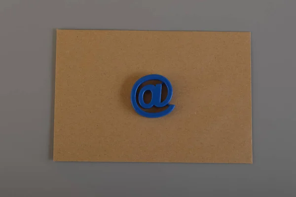 Brown envelope and email address symbol. Email marketing and email communication concept.