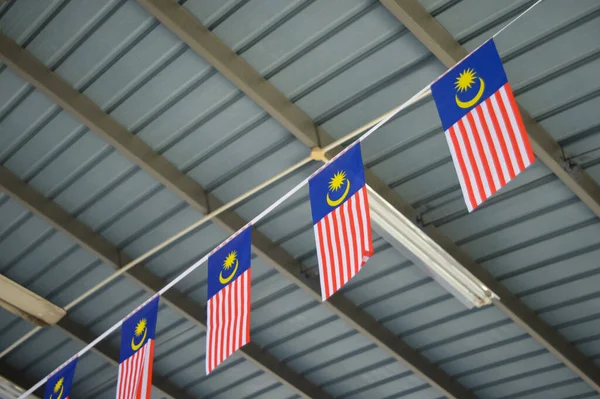 Flag of Malaysia hanging under the roof.
