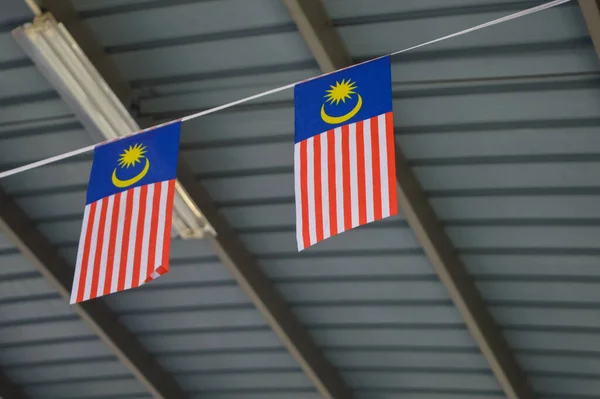 Flag of Malaysia hanging under the roof.
