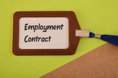 Name tag written with EMPLOYMENT CONTRACT. Signing contract for employment concept.