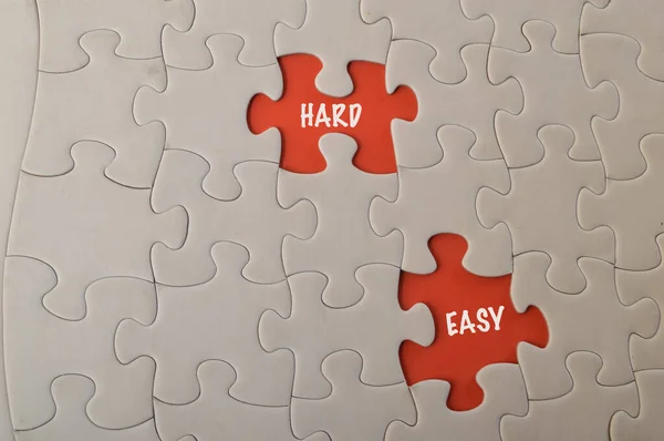 Missing jigsaw puzzles with text HARD and EASY.