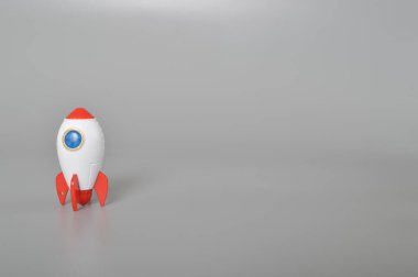 Oyuncak roketi beyaz bir arkaplanda izole edildi. Başarının sembolü başlangıç işi, eğitim ve bilgidir.