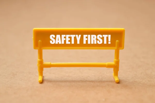 Yellow Plastic Barrier Text Safety First — Stock Photo, Image