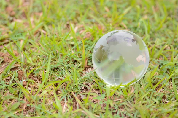 World Environment Day: Globe Glass represents circular economy, renewable energy, sustainable development goals, environmental protection, green business, ESG.