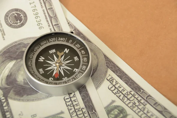 Money banknotes and compass. Navigating Wealth: Money Banknotes as a Compass to Financial Success