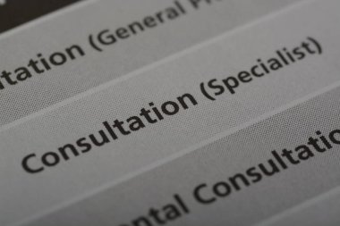 Close up view of the word CONSULTATION.A consultation is a professional interaction or meeting between an individual seeking advice, information, or guidance in a particular field. clipart