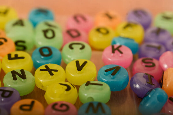 Alphabet beads, with their colorful variety and tactile feel, offer a hands-on approach to learning letters for children