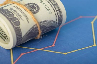 Değişen bir grafik ve para birimi küresel piyasaların birbirine bağlılığını ve ekonomik değişimlerin etkisini temsil etmektedir.