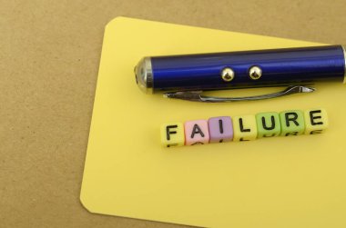 The image visually represents the concept of failure, symbolized by the word 