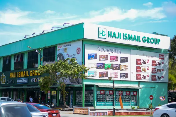 stock image Langkawi, Malaysia: October 2nd, 2024:The image shows a large, multi-story building with a green facade and a prominent sign that reads 