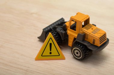 Görüntü, inşaat alanları ve ağır makinelerle ilişkili potansiyel tehlikeleri ve riskleri simgeliyor..