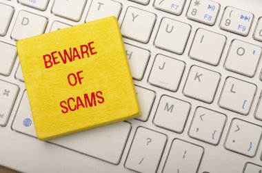 Beware of Scams Warning on Computer Keyboard clipart