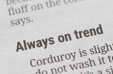 a newspaper or magazine article with a bold headline, perfectly capturing the essence of fashion, popular culture, and staying current with the latest styles.