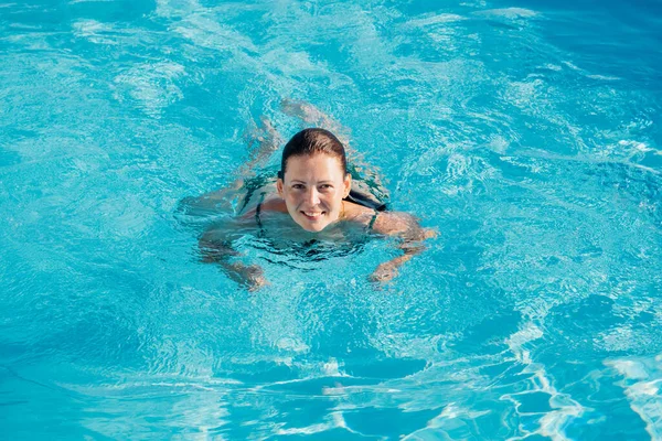 stock image Portrait of beautiful brunet woman r relaxing in swimming pool spa