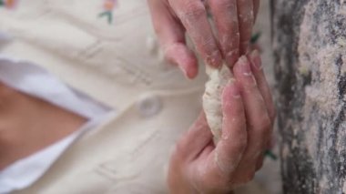 Making vegetarian dumplings with vegetables. Hands make dumpling. Woman prepares handmade dumplings. 4k footage