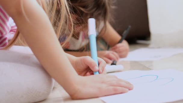 Cute Little Children Girls Lying Floor Drawing Color Markers Footage — Vídeos de Stock