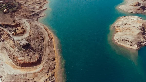 stock image Aerial view of a beautiful canyon and a river with turquoise fresh water. Nature travel background. Reservoir on the Dimchay River from a birds eye view.