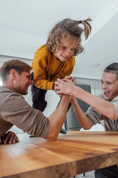 Father Competing Arm Wrestling Teenager Son Family Spending Time Together — Stock Photo, Image