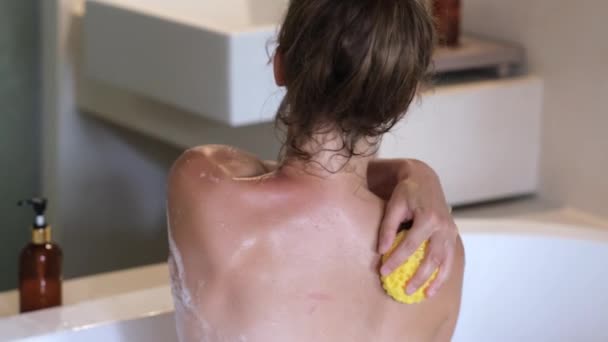 Pretty Girl Using Body Washcloth While Taking Hot Bath Home — Vídeos de Stock