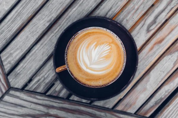 Top View Stylish Latte Coffee Mug Flower Art Wooden Table — Stockfoto