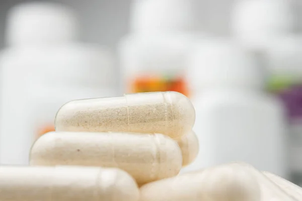 White medicine capsules, vitamin pills or drugs, medication treatment, health care concept.