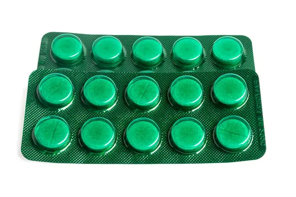 Comprimidos Comprimidos Blister Verde Isolados Sobre Fundo Branco Conceito Cuidados — Fotografia de Stock